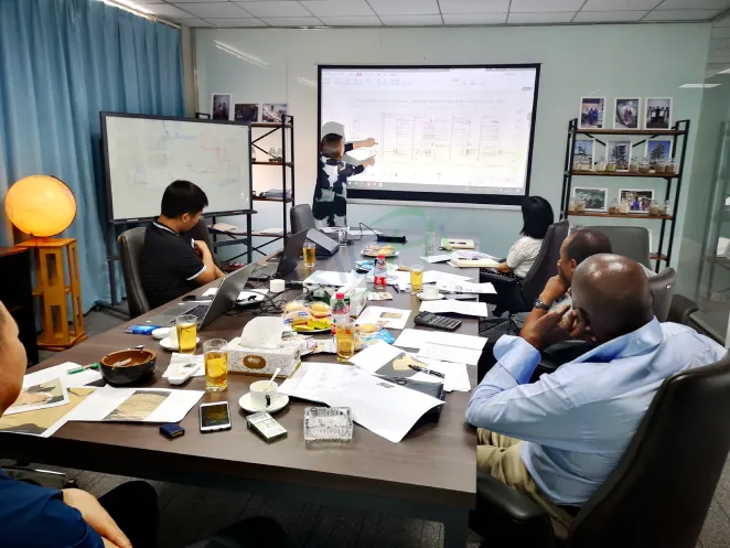 Engineer explains cow dung pellet production line process flow to Zimbabwe customer